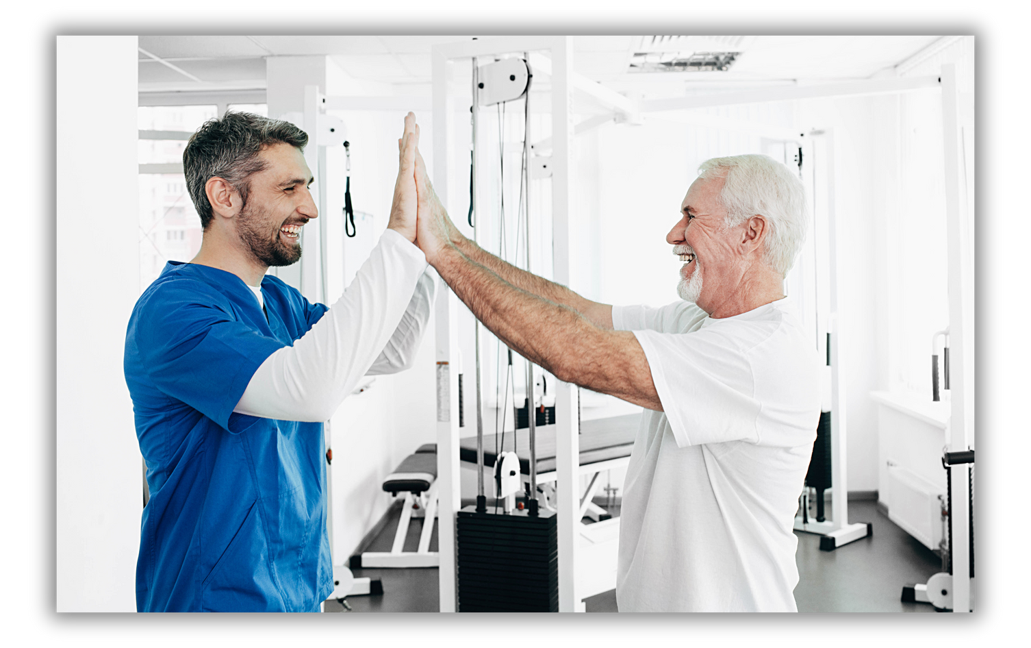 Senior man and Physical Therapist have five after successful physio treatment. physio rehabilitation